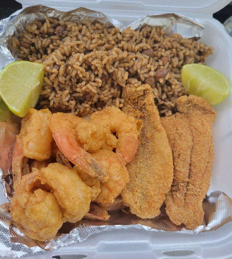 Aunt Lily’s Kitchen & Catering Cajun rice, Fish, and shrimps.